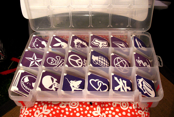 One of our stencil keepers. The slots correspond directly to the rows of designs on the posters. We keep these in a shelf unit for easy access, with the tops off. image